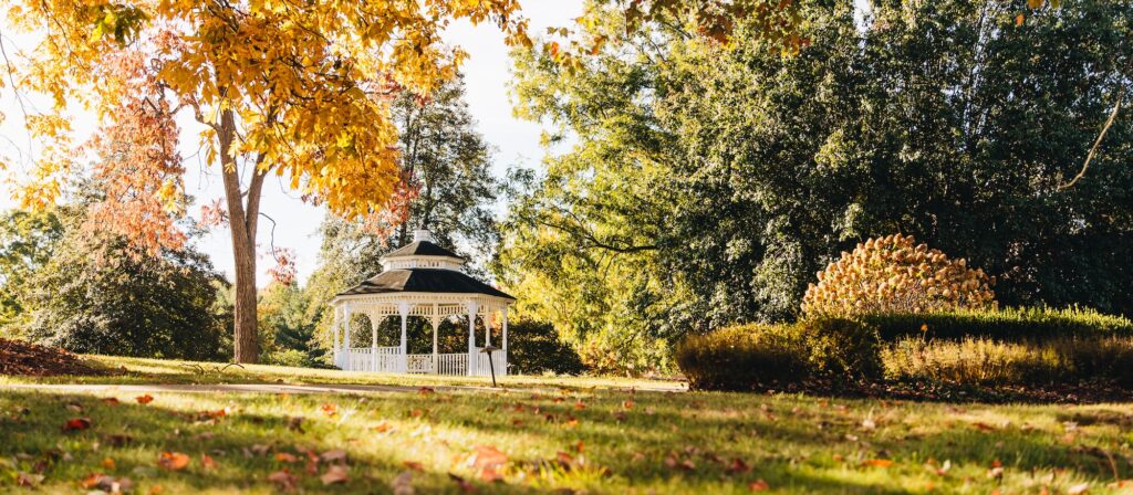 Fall foliage surrounds the gazebo on the lawn of The Martha Washington Inn & Spa in Abingdon, Virginia.